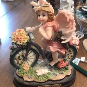 Turtle King Corp “De Elina” angel on bike.